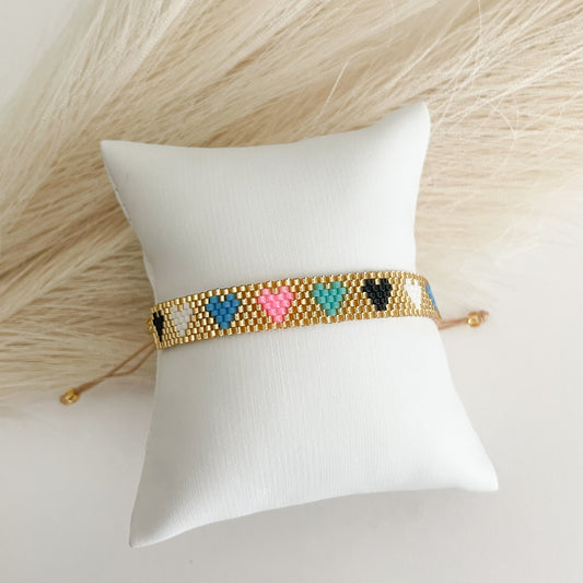 Gold bracelet with colors hearts